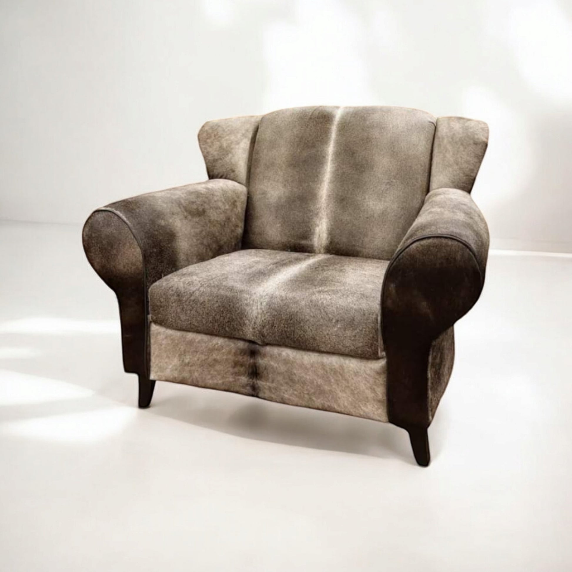 Bommel fauteuil in grijs koeienhuid